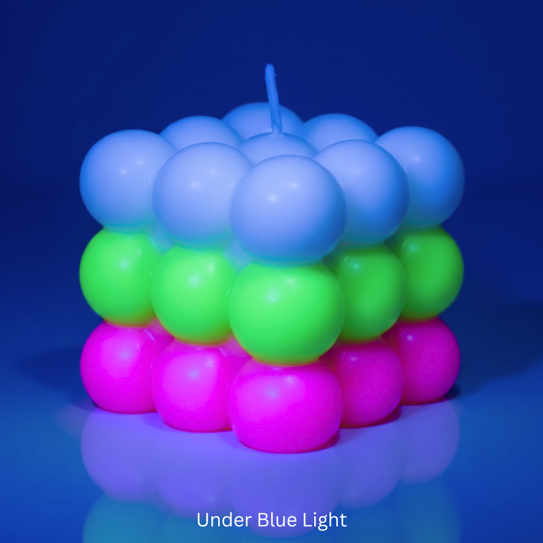 Candle made of colorful spheres under blue light
Sensations Unleashed Glow in the Dark + UV Wax Play Big Bubble Candle In India - Triple Colour